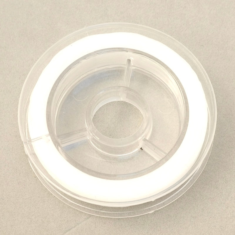 Bobine de 10 mètres de fil Elastique plat 0,6mm Transparent